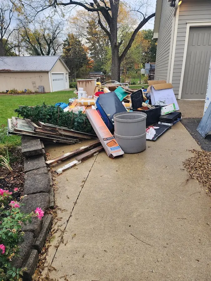 Dumpster being loaded with debris for Commercial Dumpster Rental in Pembroke